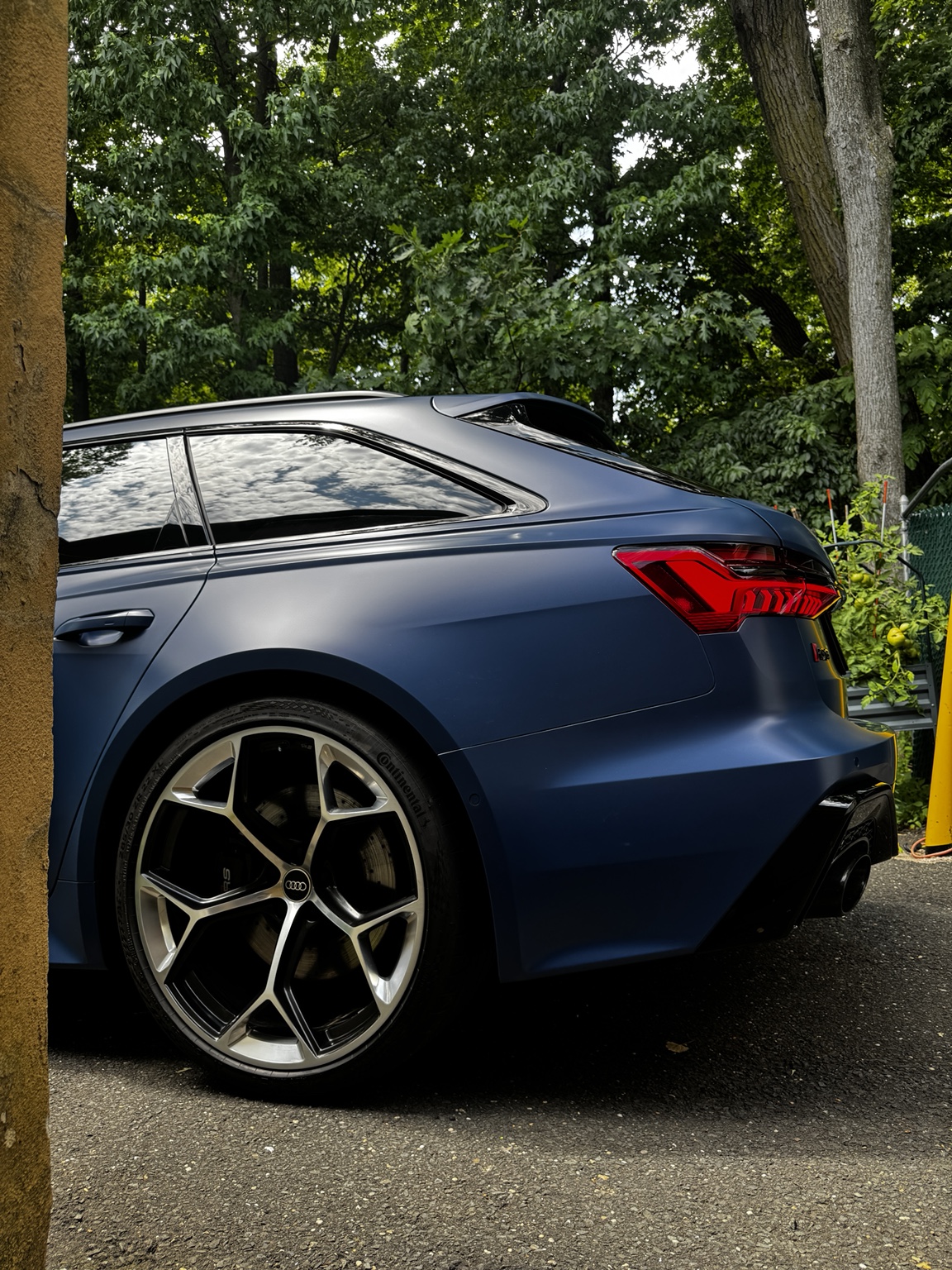 Audi RS6 Avant rear quarter detail showing the Navarra Blue satin finish