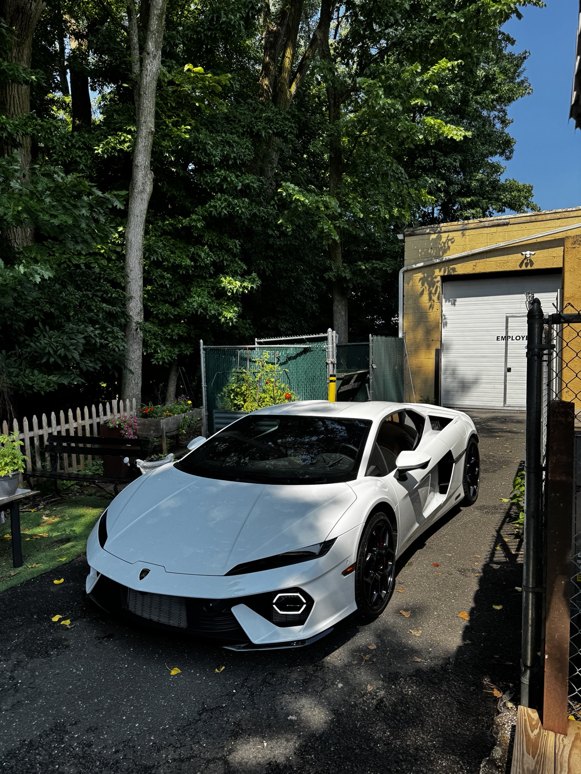White Lamborghini Temerario outdoors with windshield protection film